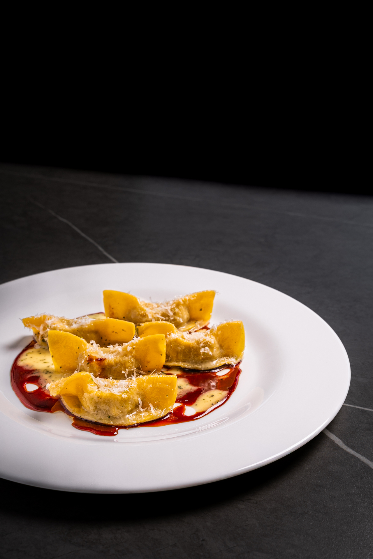 Casoncelli alla bergamasca con parmigiano — food photographer Nord Italia